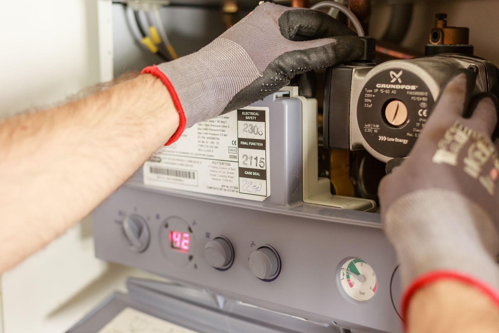 Boiler pump being inspected by a technician